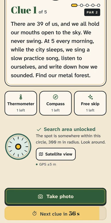 The Competitive stop screen: the Thermometer, Compass and Free skip lifelines, the search area unlocked, a 300 m circle, and the next clue counting down